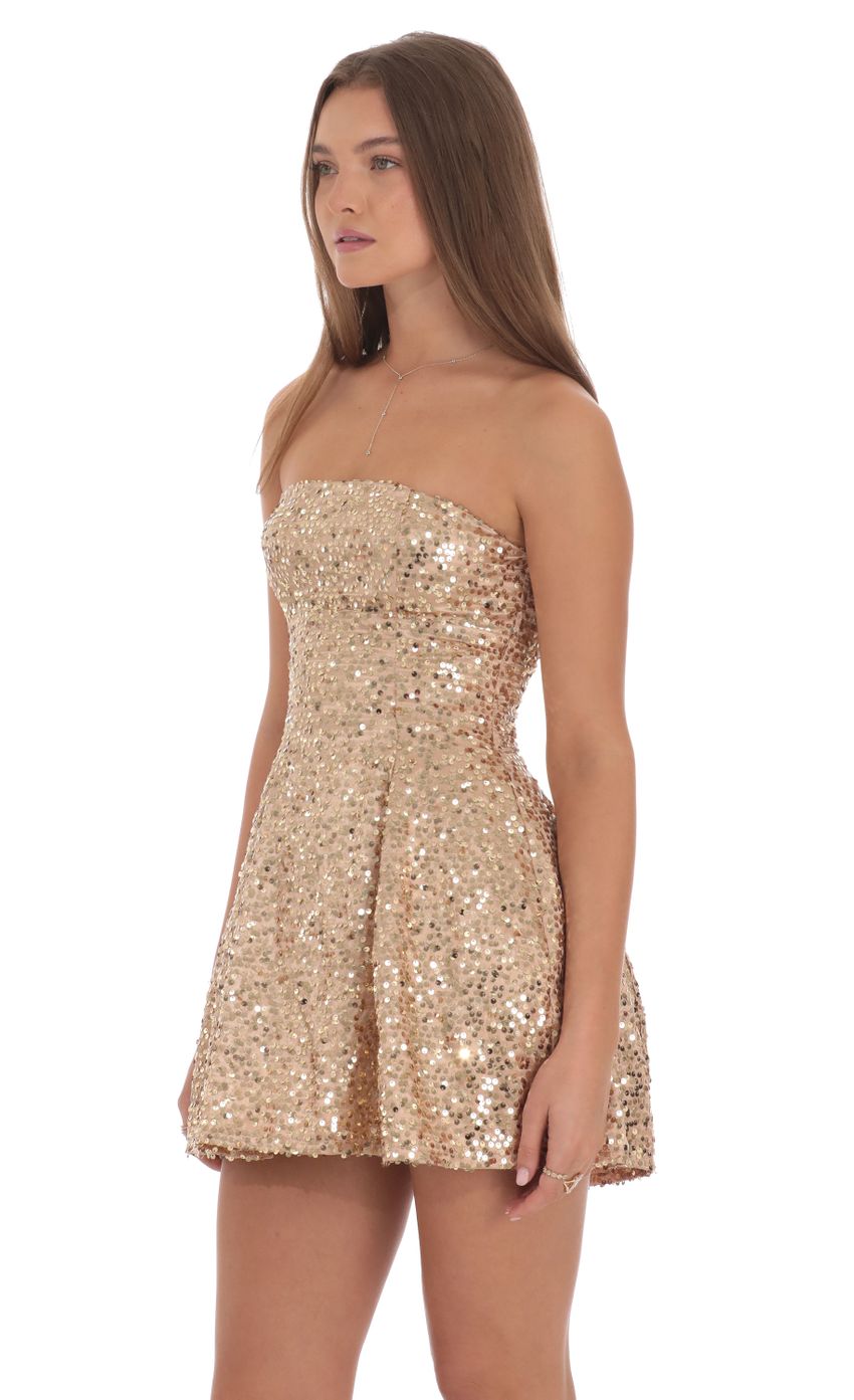 Picture Sequin Strapless Fit and Flare Dress in Gold. Source: https://media-img.lucyinthesky.com/data/Oct24/850xAUTO/3ad5b408-cfea-48d4-8ab5-9fb2b69238b5.jpg