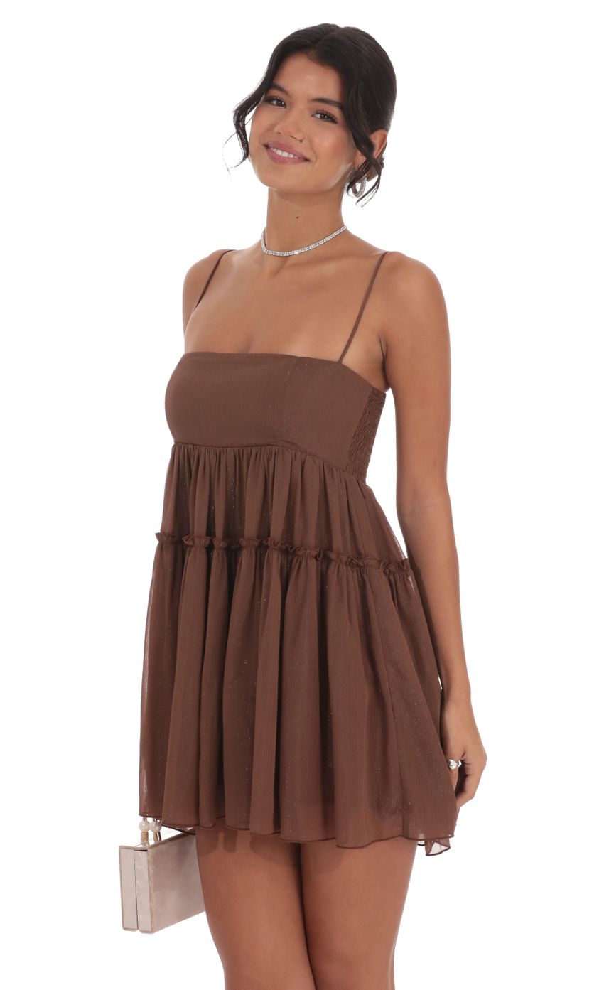 Picture Shimmer Babydoll Dress in Brown. Source: https://media-img.lucyinthesky.com/data/Oct24/850xAUTO/46533661-b31e-4c8b-8cdc-521edc88af64.jpg