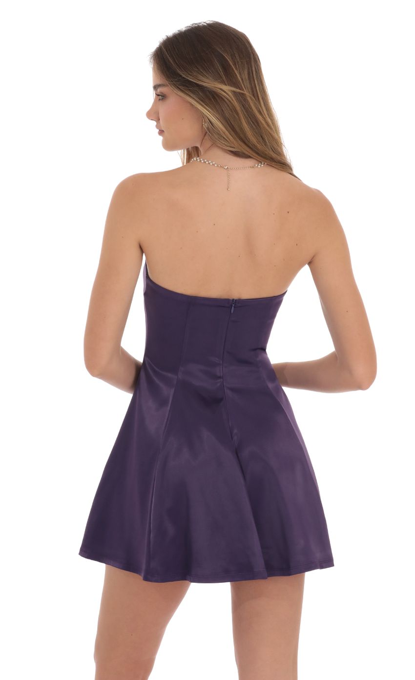 Picture Strapless Satin Fit and Flare Dress in Purple. Source: https://media-img.lucyinthesky.com/data/Oct24/850xAUTO/65685f47-faab-465b-a9e3-51fe6a39755a.jpg