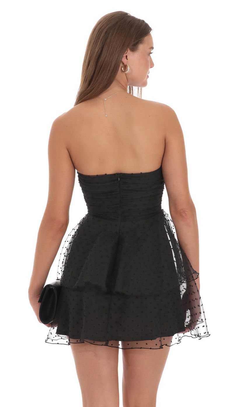 Picture Dotted Petal Ruffle Strapless Dress in Black. Source: https://media-img.lucyinthesky.com/data/Oct24/850xAUTO/829d7cf7-3064-4525-a181-acb425014e3d.jpg