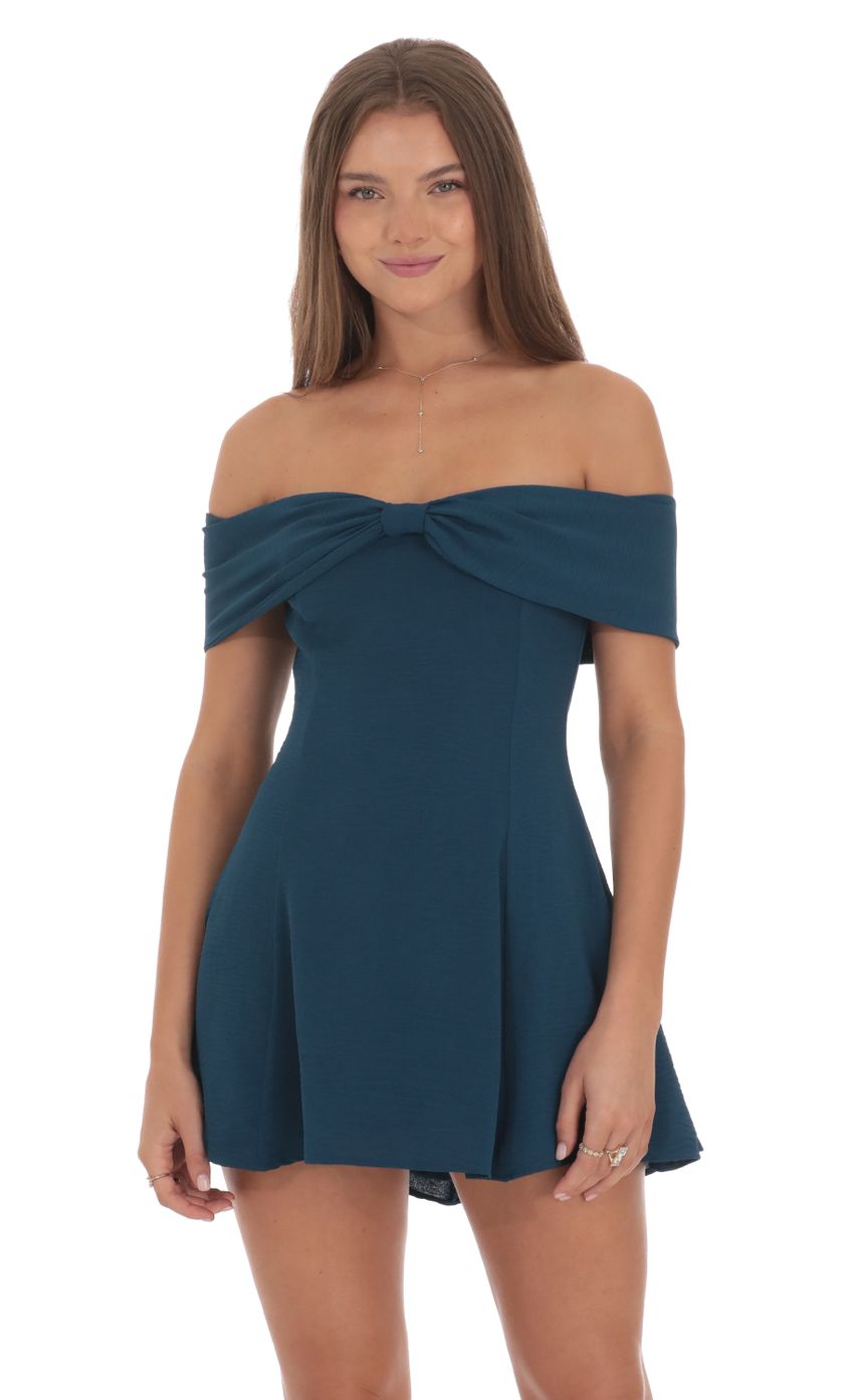 Picture Front Bow Off Shoulder Dress in Dark Teal. Source: https://media-img.lucyinthesky.com/data/Oct24/850xAUTO/a60c5405-cf86-4a8e-a7fd-a64fb5fdfe6d.jpg