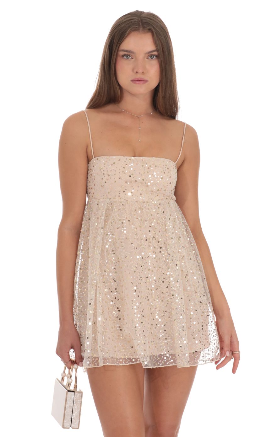 Picture Sequin Baby Doll Dress in Beige. Source: https://media-img.lucyinthesky.com/data/Oct24/850xAUTO/af02ddfa-4dde-44b8-ab7f-c4adb855da44.jpg