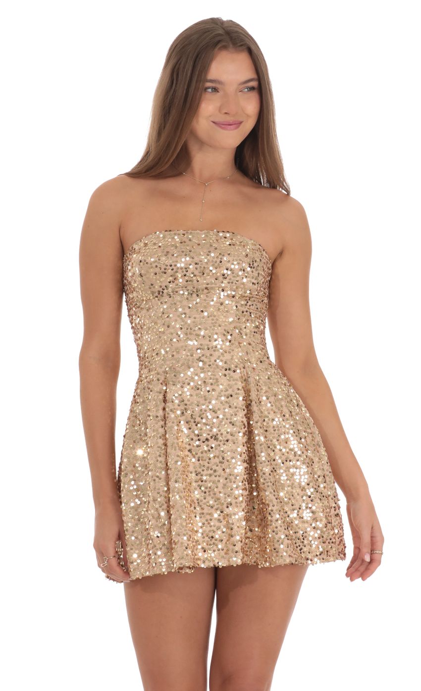 Picture Sequin Strapless Fit and Flare Dress in Gold. Source: https://media-img.lucyinthesky.com/data/Oct24/850xAUTO/b0484556-1c44-41aa-ba73-9bdd0fd3f1ab.jpg