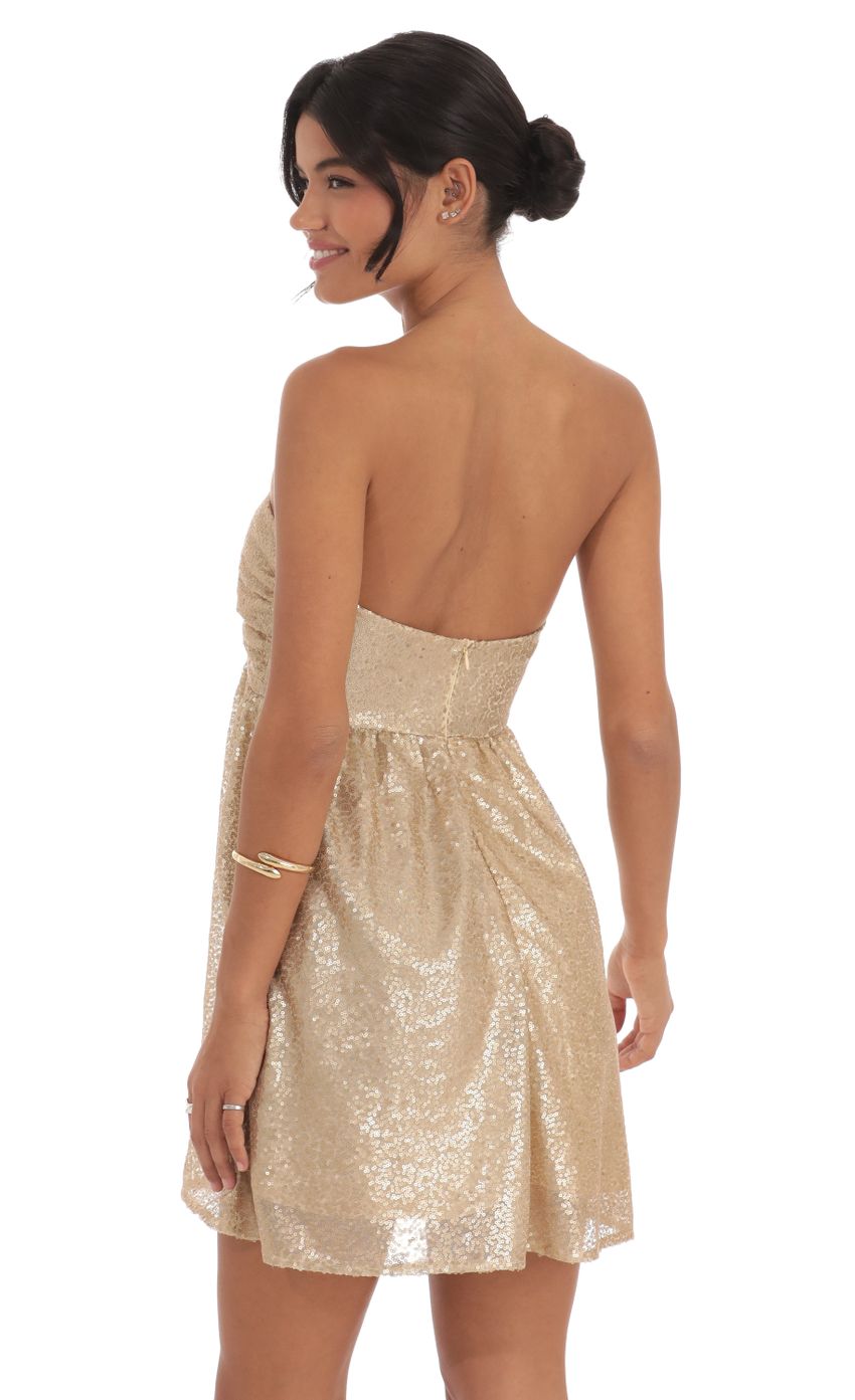 Picture Sequin Babydoll Dress in Gold. Source: https://media-img.lucyinthesky.com/data/Oct24/850xAUTO/bc8d6062-4126-493f-94d7-81764ec2db90.jpg