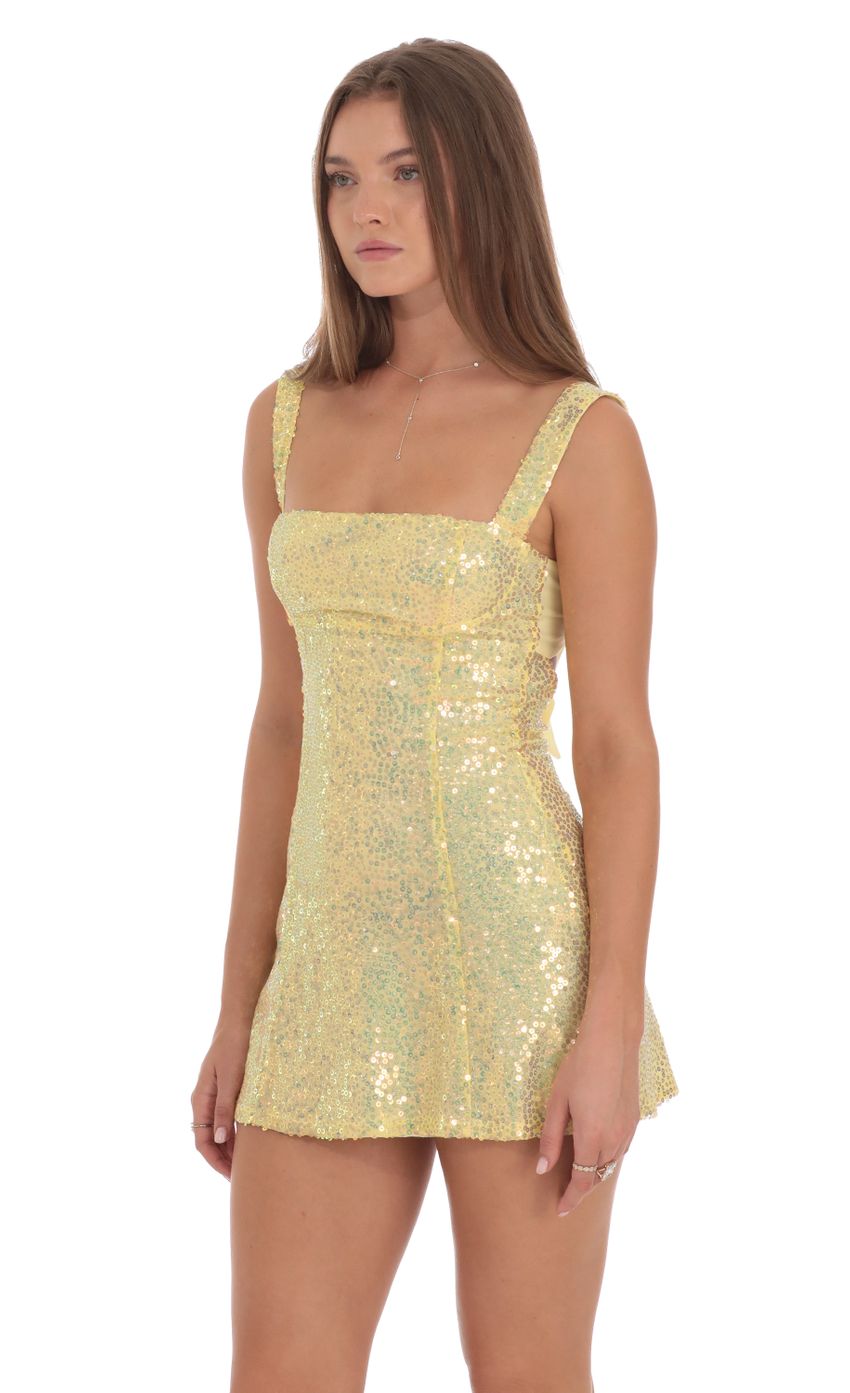 Picture Sequin GLitter Back Bow Bodycon Dress in Yellow. Source: https://media-img.lucyinthesky.com/data/Oct24/850xAUTO/d08d07ef-095d-4c79-892a-f71419e95f39.jpg