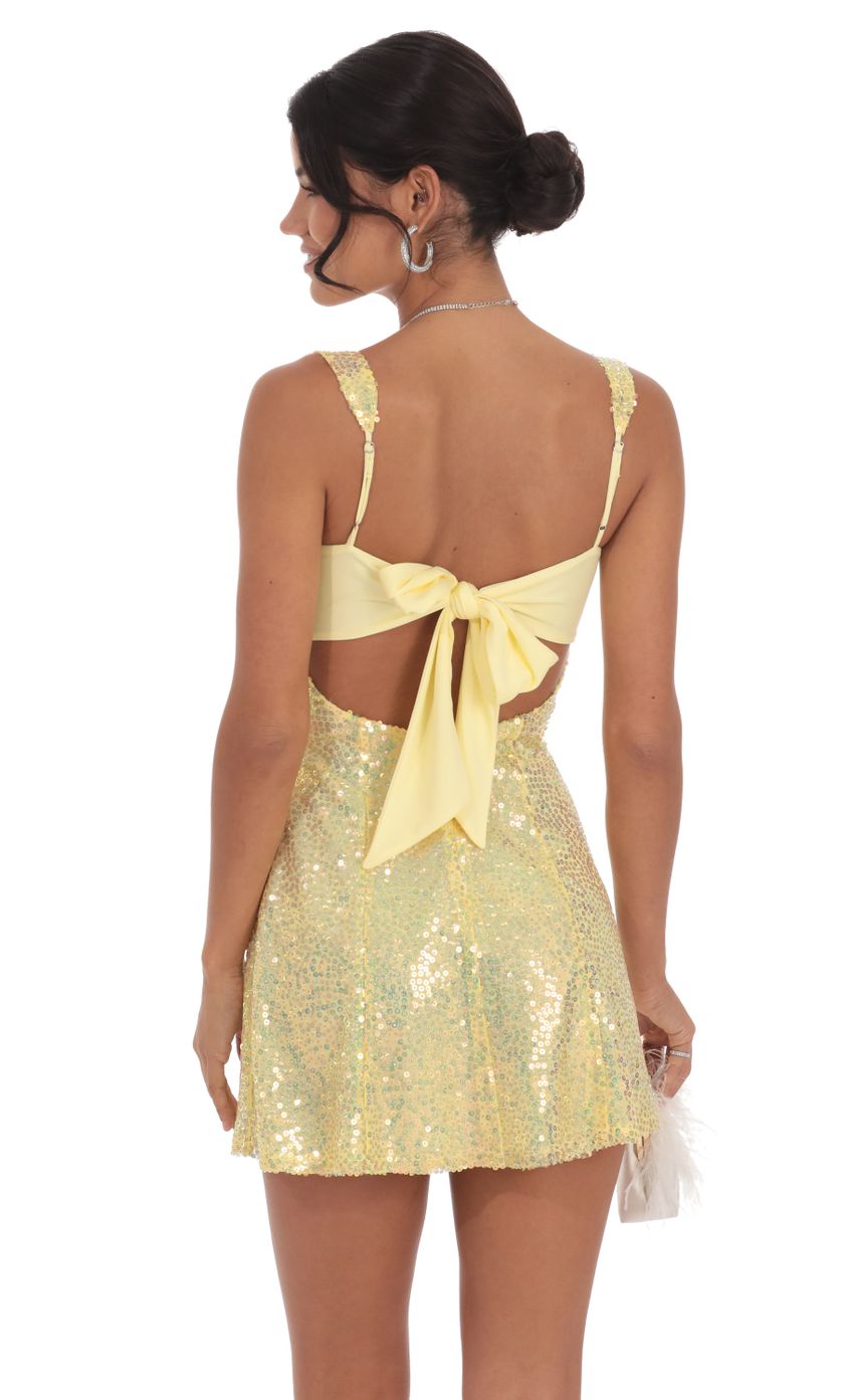 Picture Sequin Glitter Back Bow Bodycon Dress in Yellow. Source: https://media-img.lucyinthesky.com/data/Oct24/850xAUTO/dd3ea15a-f487-46e7-8b85-4e51c6a104df.jpg