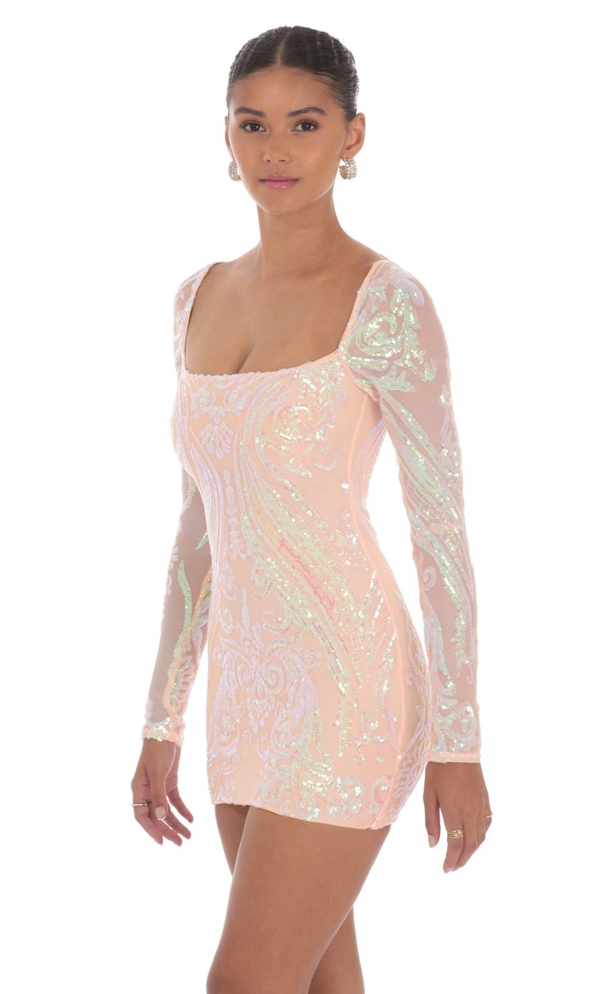 Picture Iridescent Sequin Long Sleeve Dress in Peach. Source: https://media-img.lucyinthesky.com/data/Oct24/850xAUTO/e15c0707-4b38-454e-a718-fa38682f8ef8.jpg