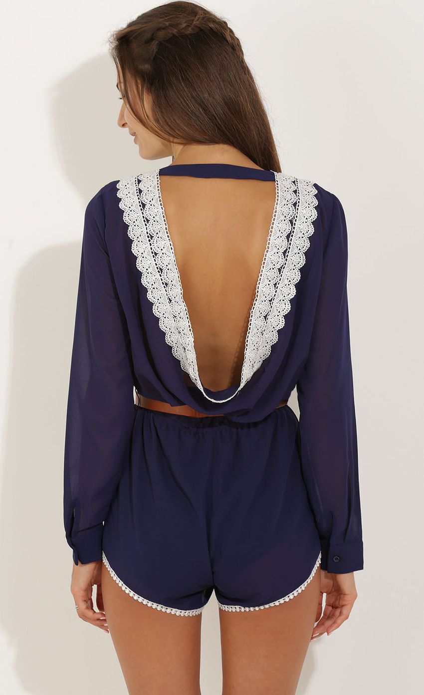 Picture Lace-Trimmed Playsuit in Navy Blue. Source: https://media-img.lucyinthesky.com/data/Sep15_1/850xAUTO/0Y5A3389.JPG