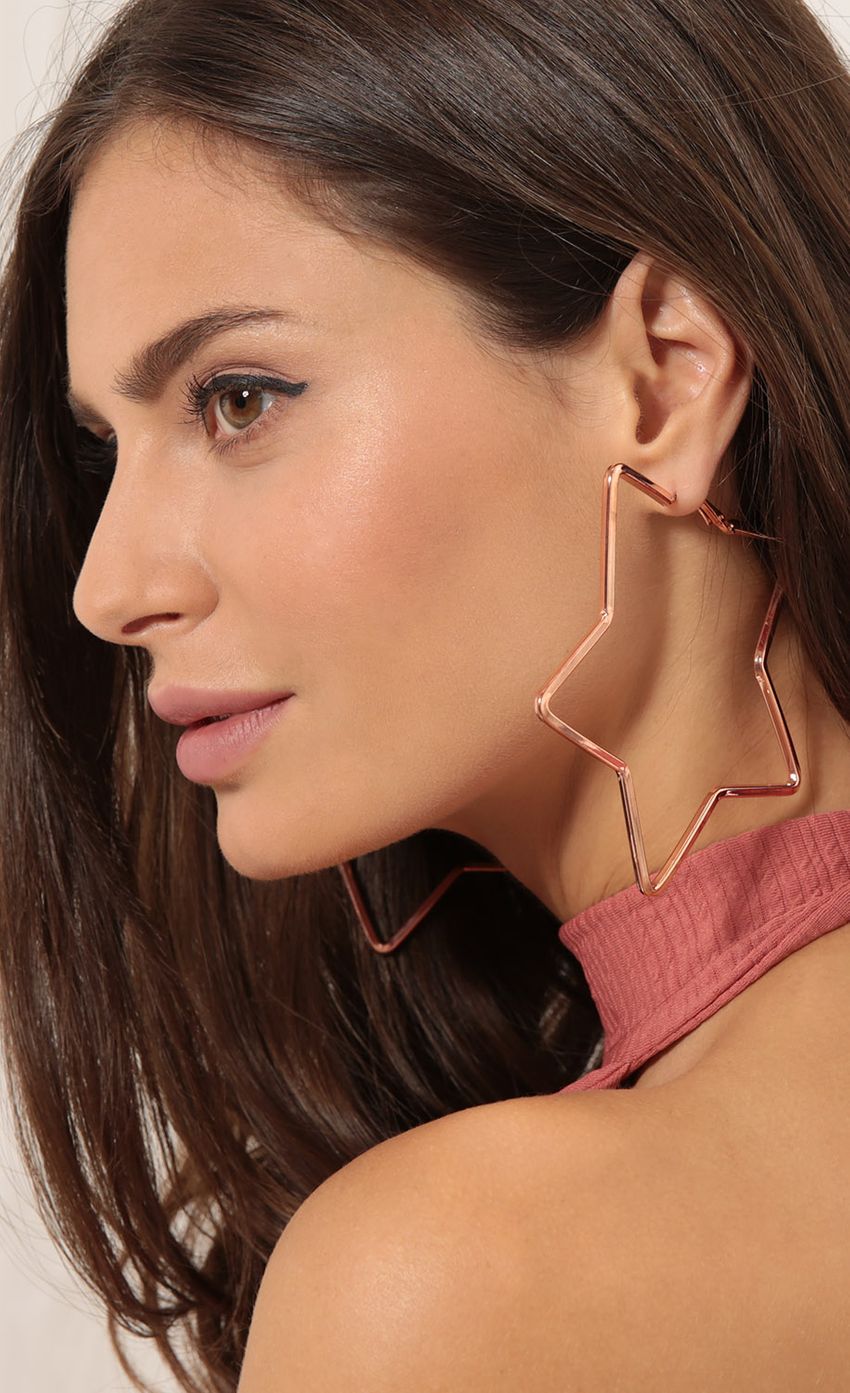 Picture Star Shaped Hoops In Rose Gold. Source: https://media-img.lucyinthesky.com/data/Sep17_2/850xAUTO/0Y5A0837SS.JPG