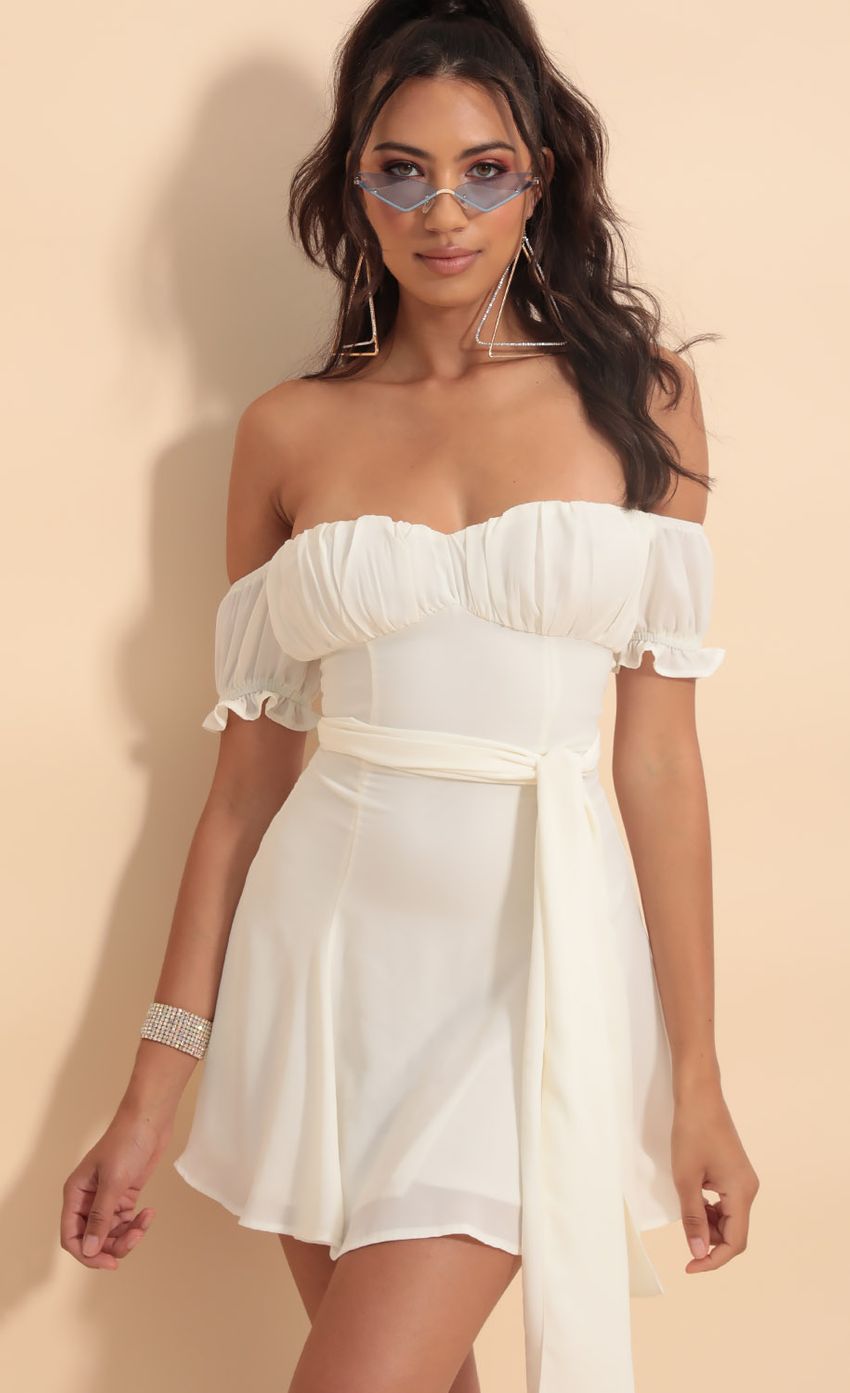 Picture Marnie Ruched Wrap Tie Dress in Ivory. Source: https://media-img.lucyinthesky.com/data/Sep19_1/850xAUTO/781A8713.JPG