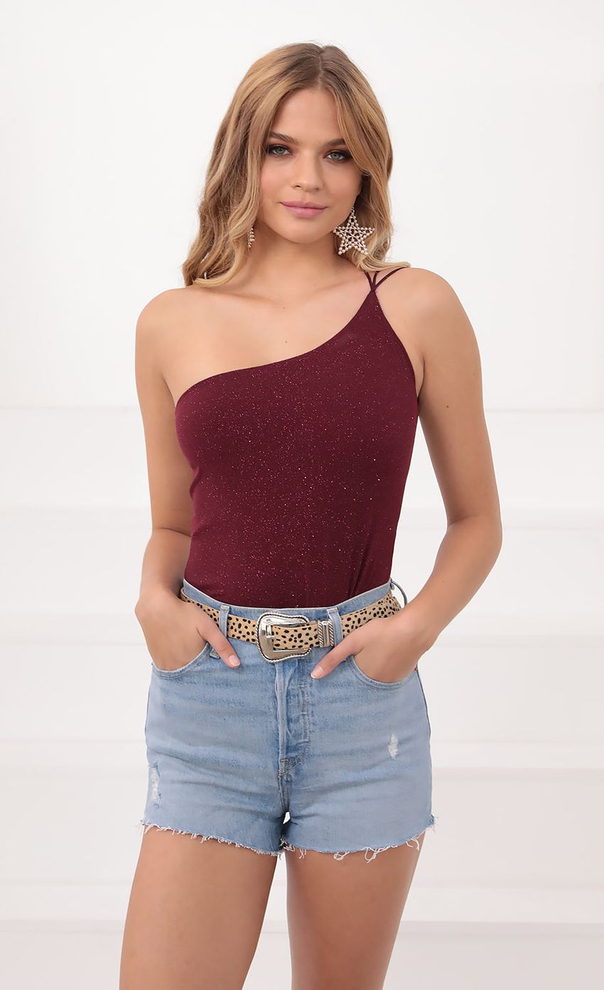 Picture One Shoulder Shimmer Bodysuit in Burgundy. Source: https://media-img.lucyinthesky.com/data/Sep20_1/850xAUTO/781A0405.JPG