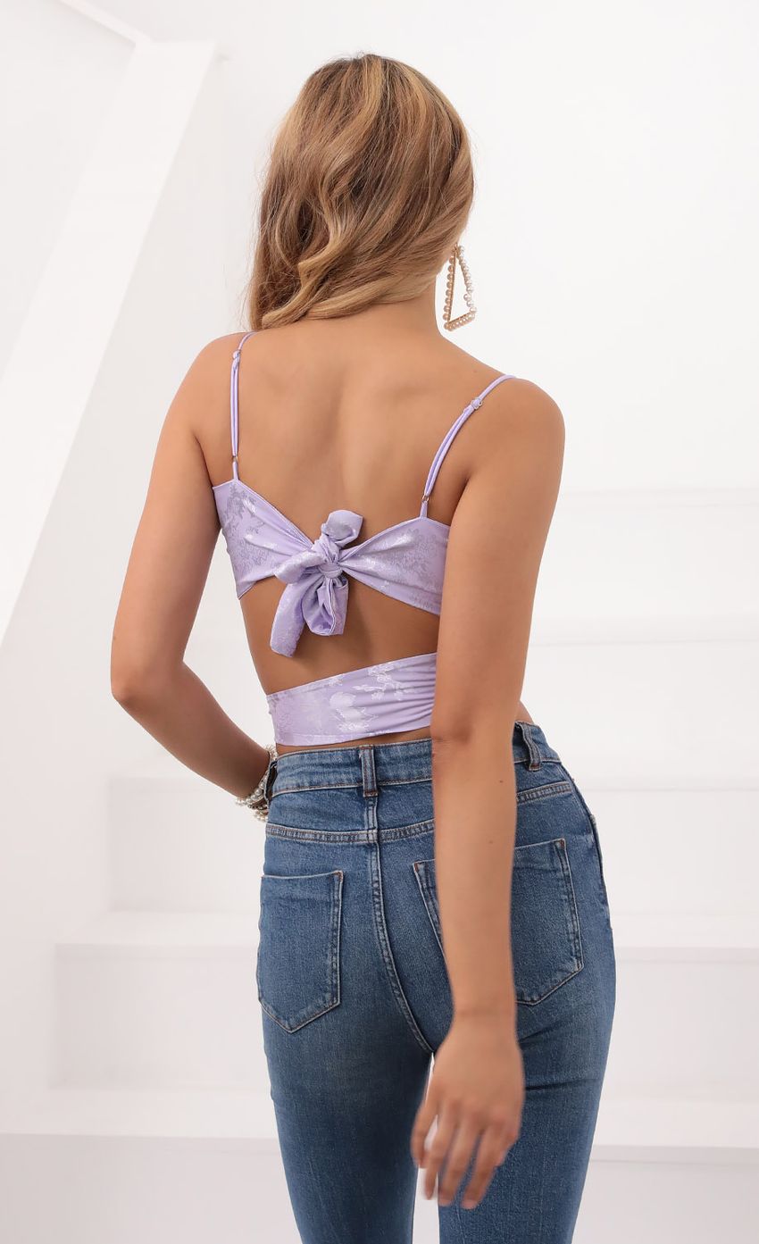 Picture Jacquard Wrap Top in Lavender. Source: https://media-img.lucyinthesky.com/data/Sep20_1/850xAUTO/781A3259.JPG