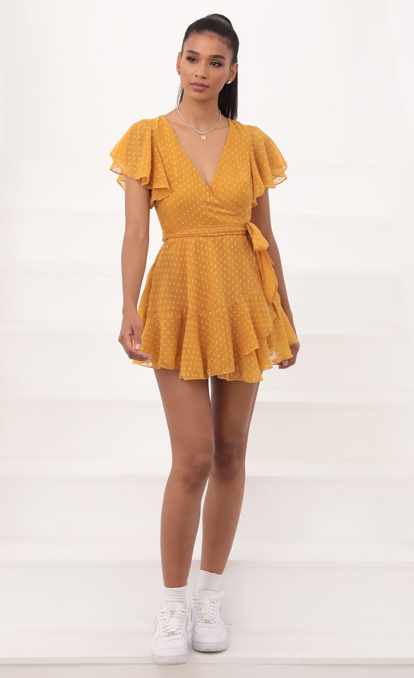Picture Eliza Wrap Dress in Yellow Dotted Chiffon. Source: https://media-img.lucyinthesky.com/data/Sep20_2/850xAUTO/781A2412.JPG