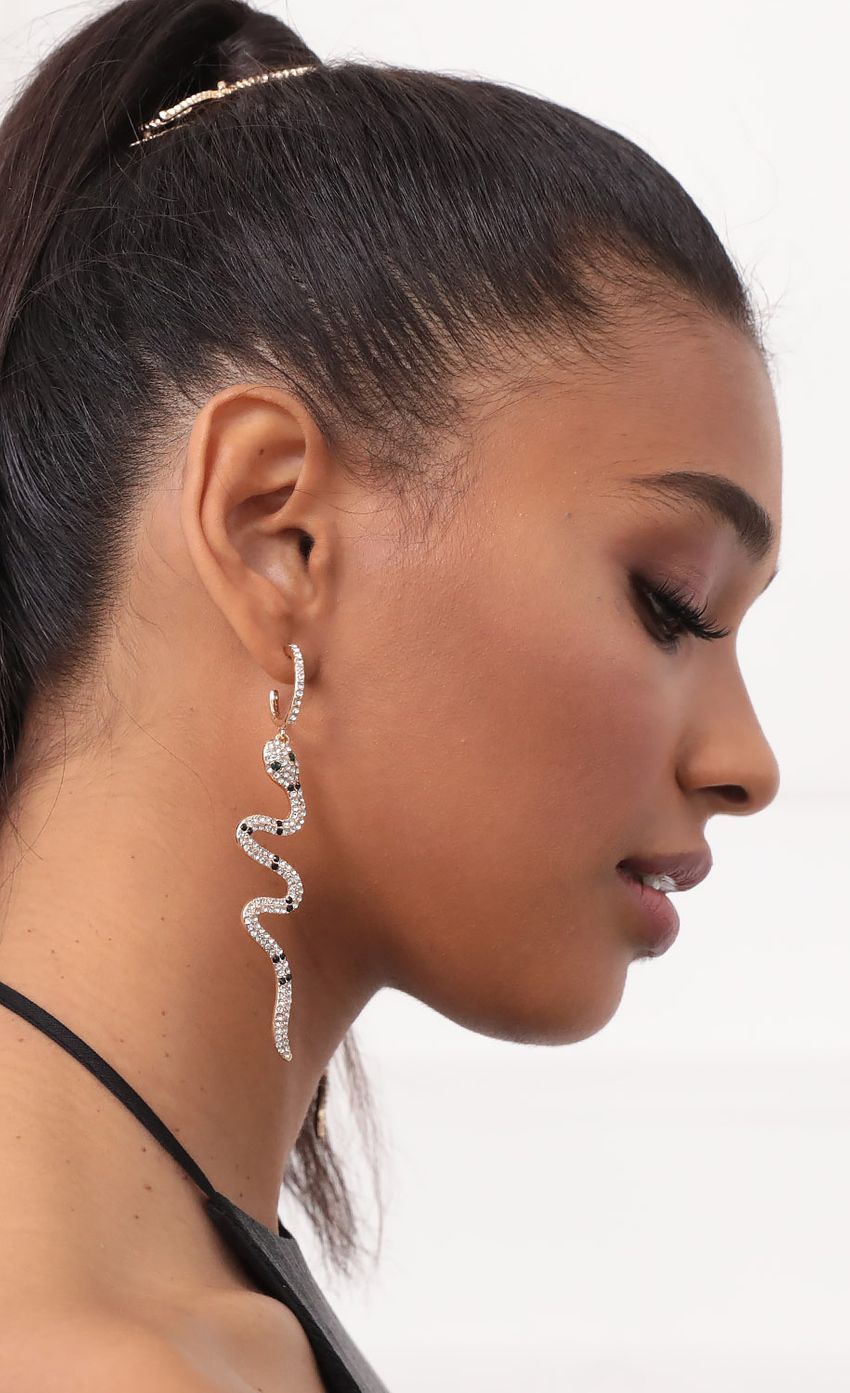 Picture Dannielle Sexy Hoop Snake Earrings in Gold. Source: https://media-img.lucyinthesky.com/data/Sep20_2/850xAUTO/781A6595.JPG