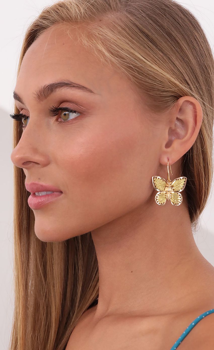 Picture Threaded Beauty Butterfly Earrings in Gold. Source: https://media-img.lucyinthesky.com/data/Sep21_1/850xAUTO/1V9A2390.JPG
