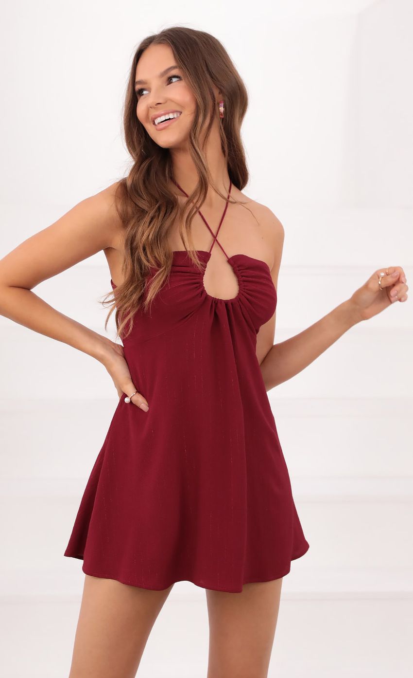 Picture Fit and Flare Dress in Burgundy Pinstripe. Source: https://media-img.lucyinthesky.com/data/Sep21_1/850xAUTO/1V9A5619.JPG