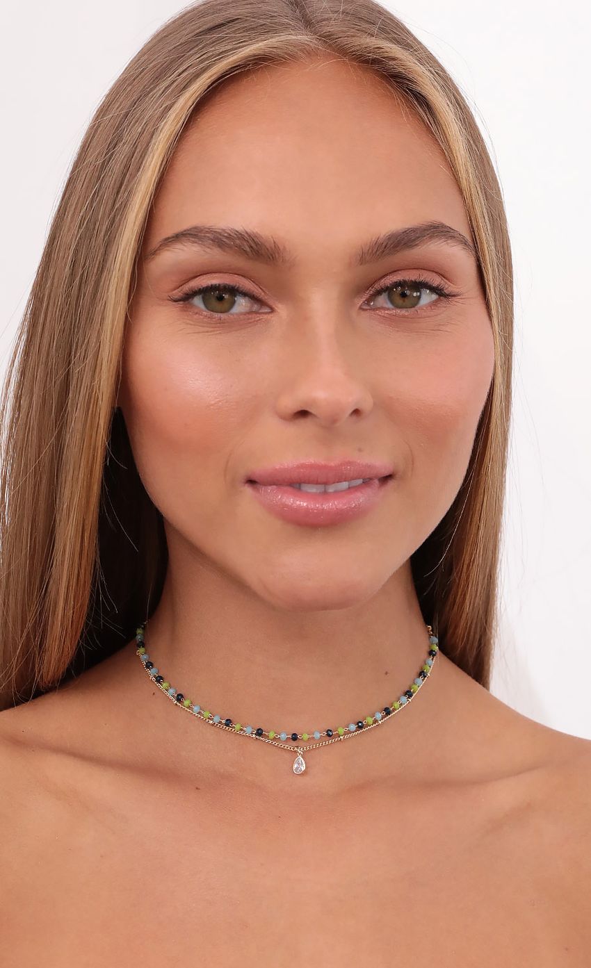 Picture Beaded Glory Choker in Gold. Source: https://media-img.lucyinthesky.com/data/Sep21_2/850xAUTO/1V9A3895.JPG
