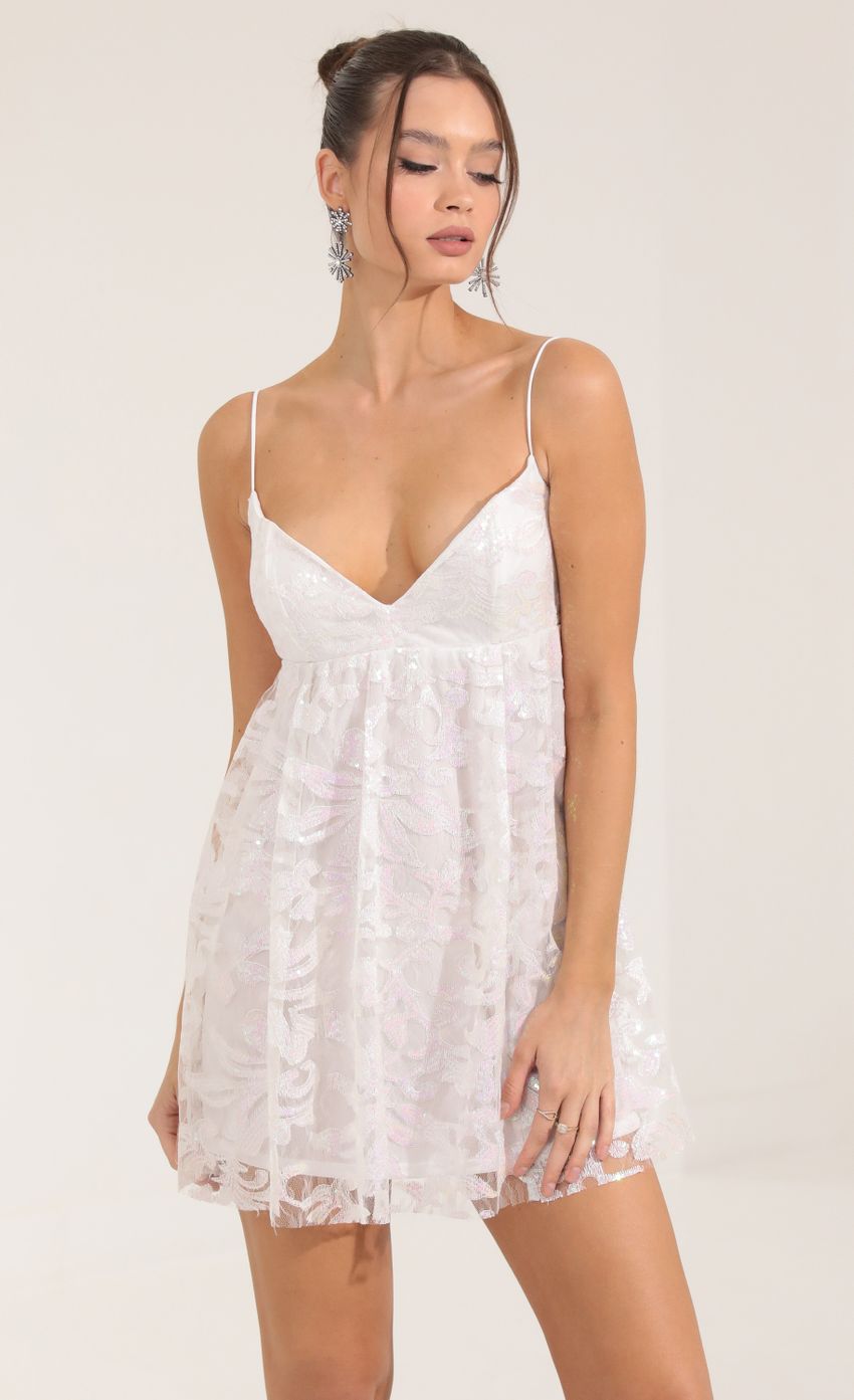 Picture Sequin Tulle Baby Doll Dress in White. Source: https://media-img.lucyinthesky.com/data/Sep22/850xAUTO/142073ac-1c0e-42c1-b001-4179af7df63d.jpg