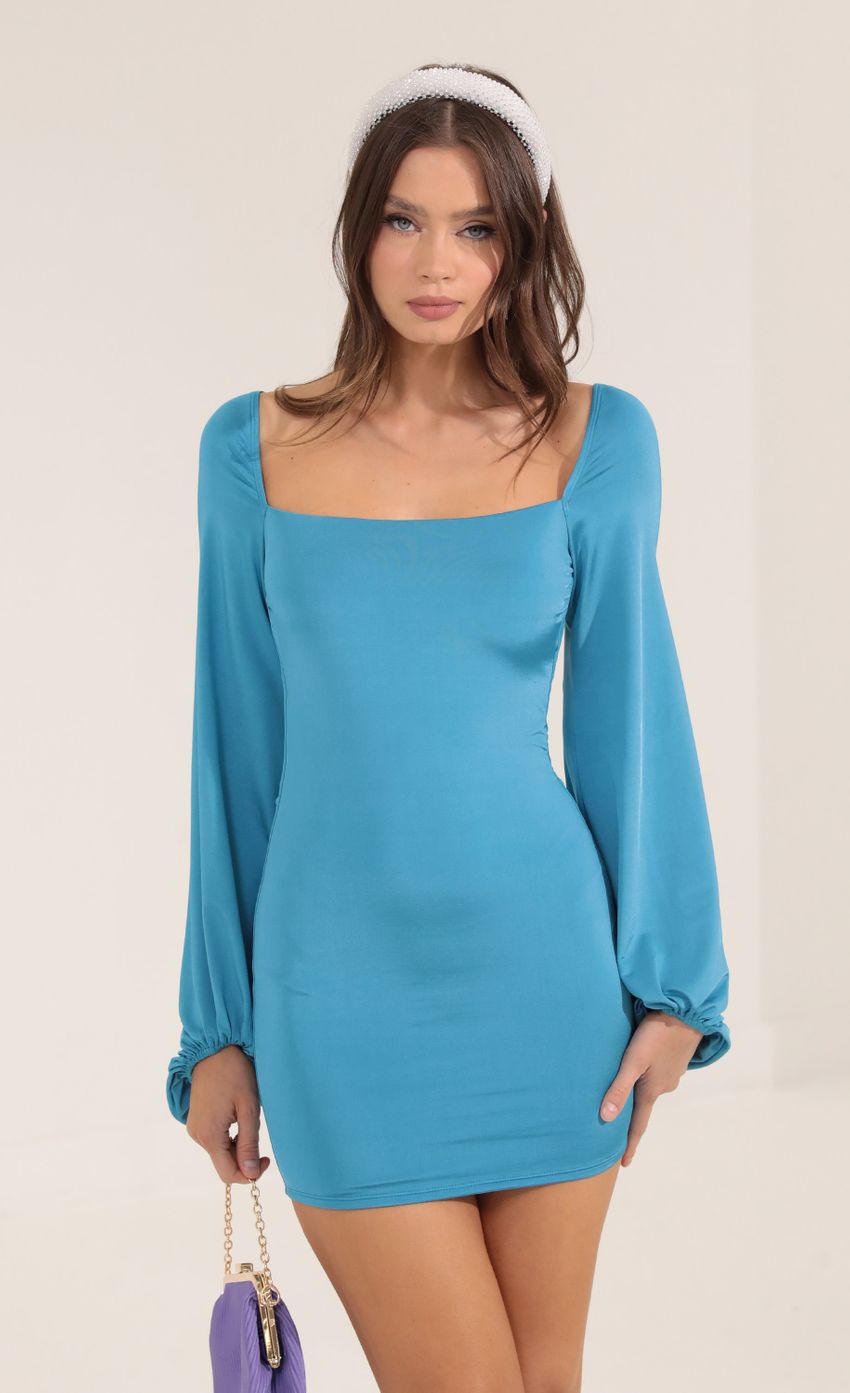 Picture Satin Open Back Long Sleeve Dress in Blue. Source: https://media-img.lucyinthesky.com/data/Sep22/850xAUTO/44d3eb71-1adf-401b-a3f3-7177b4bc7820.jpg