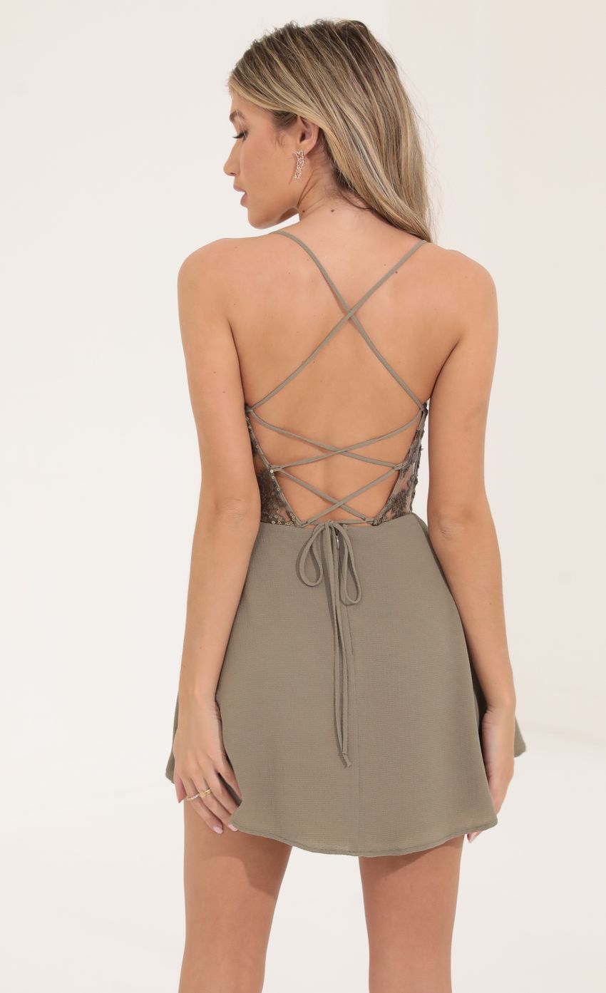 Picture Embroidered Cutout Dress in Taupe. Source: https://media-img.lucyinthesky.com/data/Sep22/850xAUTO/bb7ed002-8a74-4ec8-b801-0ba82e36ad00.jpg