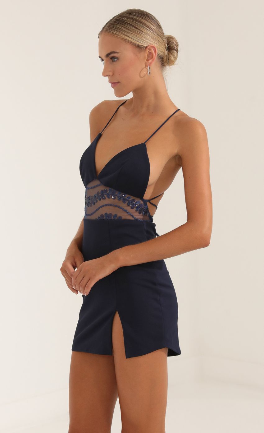 Picture Embroidered Sequin Cutout Dress in Navy. Source: https://media-img.lucyinthesky.com/data/Sep22/850xAUTO/bfd0389d-36d4-403a-9fb1-81edcea04847.jpg