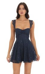 Picture Lace Sequin Fit and Flare Dress in Navy. Source: https://media-img.lucyinthesky.com/data/Sep23/150xAUTO/232bdcbd-ee22-4ab2-82bf-f82a678a9d04.jpg