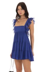 Picture Gisela Shimmer Baby Doll Ruffle Dress in Blue. Source: https://media-img.lucyinthesky.com/data/Sep23/150xAUTO/767a4376-4705-471c-95e5-b92d1ac810bd.jpg