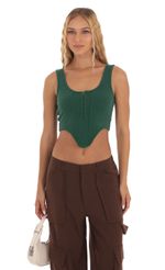 Picture Ribbed Corset Tank Top in Green. Source: https://media-img.lucyinthesky.com/data/Sep23/150xAUTO/e488768c-6c46-4609-b7eb-54826c3c6bb1.jpg