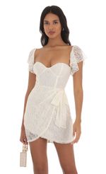 Picture Lace Corset Wrap Dress in Ivory. Source: https://media-img.lucyinthesky.com/data/Sep23/150xAUTO/f07cf1e0-ef36-45b0-a97c-1a8987cc025b.jpg