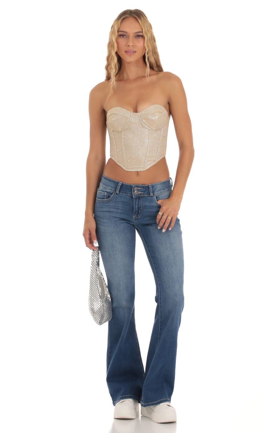 Picture Shimmer Corset Top in Gold. Source: https://media-img.lucyinthesky.com/data/Sep23/850xAUTO/165a1190-e9a3-4c79-b4ef-ae9e50a06d38.jpg