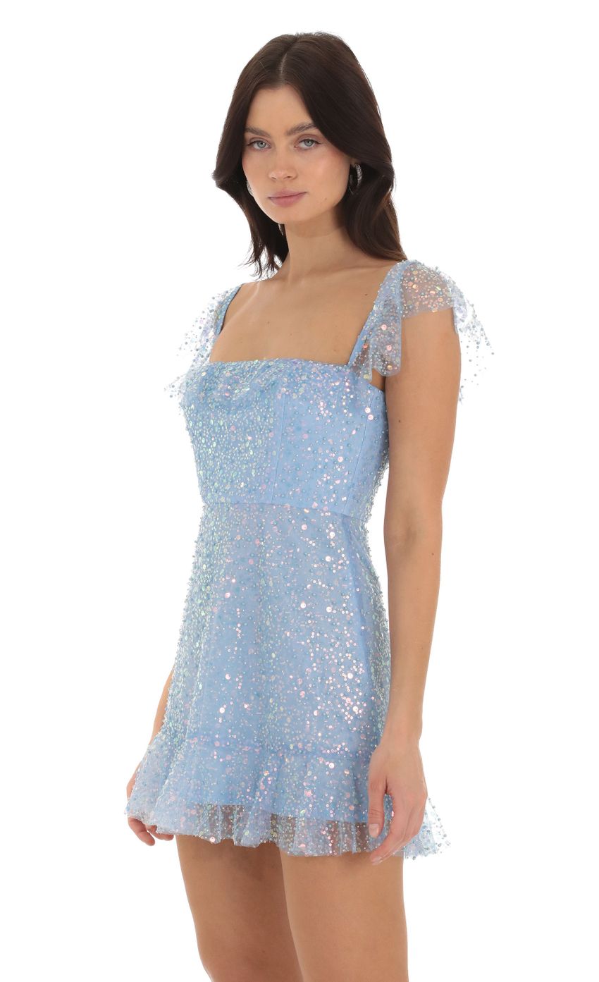 Picture Celosia Sequin Ruffle Dress in Blue. Source: https://media-img.lucyinthesky.com/data/Sep23/850xAUTO/3498495b-fd91-405c-ba68-35a45d6f168a.jpg