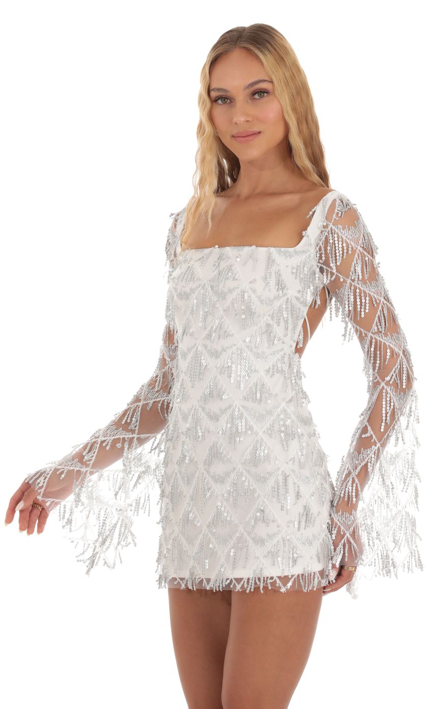 Picture Sadee Silver Fringe Sequin Dress in White. Source: https://media-img.lucyinthesky.com/data/Sep23/850xAUTO/716342aa-7597-4bb3-8d2c-7f171673069c.jpg