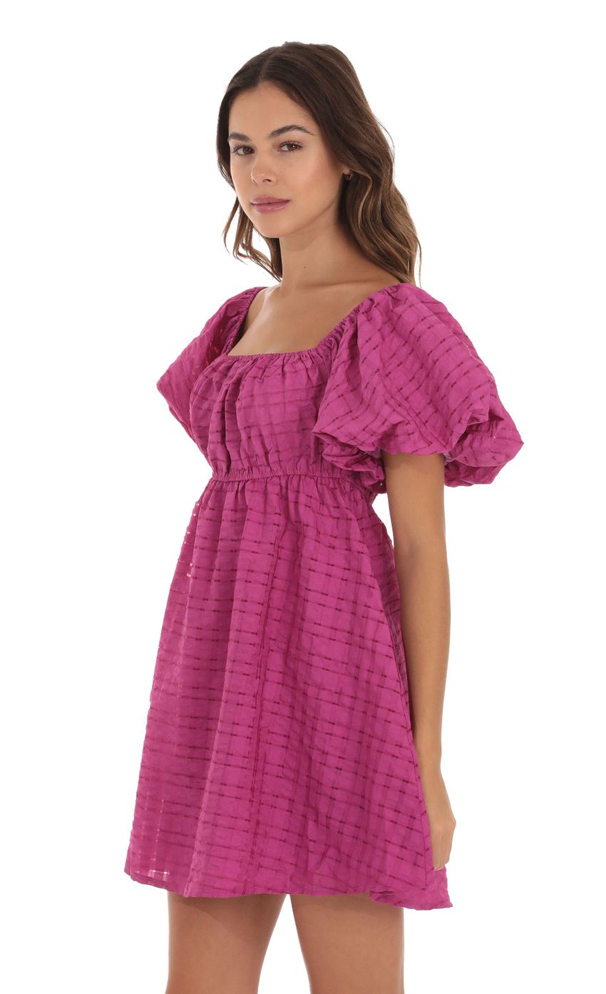 Picture Puff Sleeve Babydoll Dress in Magenta. Source: https://media-img.lucyinthesky.com/data/Sep23/850xAUTO/86f162eb-9686-4560-a1c2-8102d6cfd457.jpg