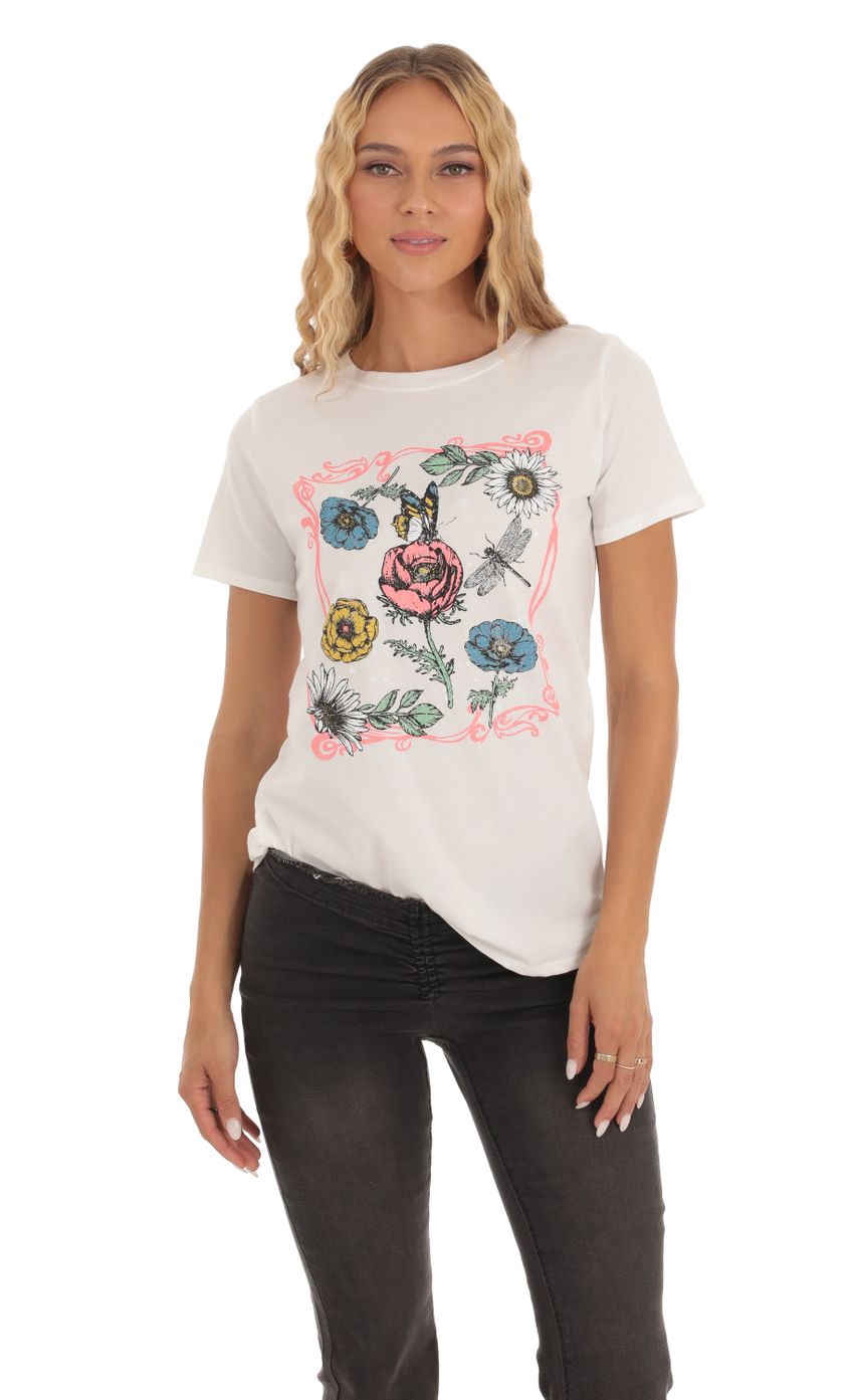 Picture Floral Graphic T-Shirt in White. Source: https://media-img.lucyinthesky.com/data/Sep23/850xAUTO/93df4727-db0a-42cb-a790-16cc7d9c4669.jpg