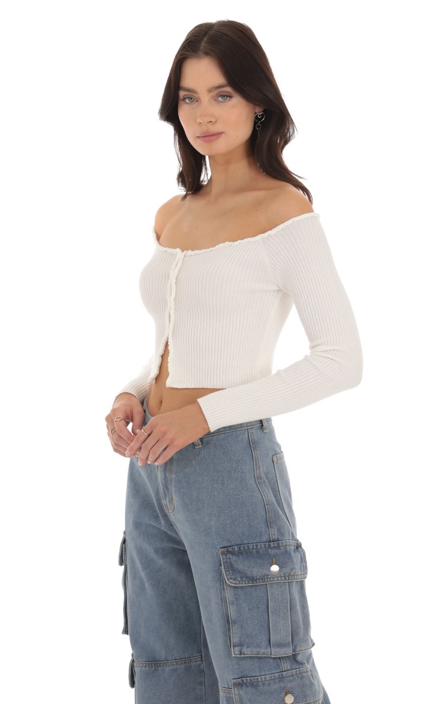 Picture Knit Off Shoulder Top in Ivory. Source: https://media-img.lucyinthesky.com/data/Sep23/850xAUTO/b1992a0e-86e5-4b0e-8992-1b8a982552a0.jpg