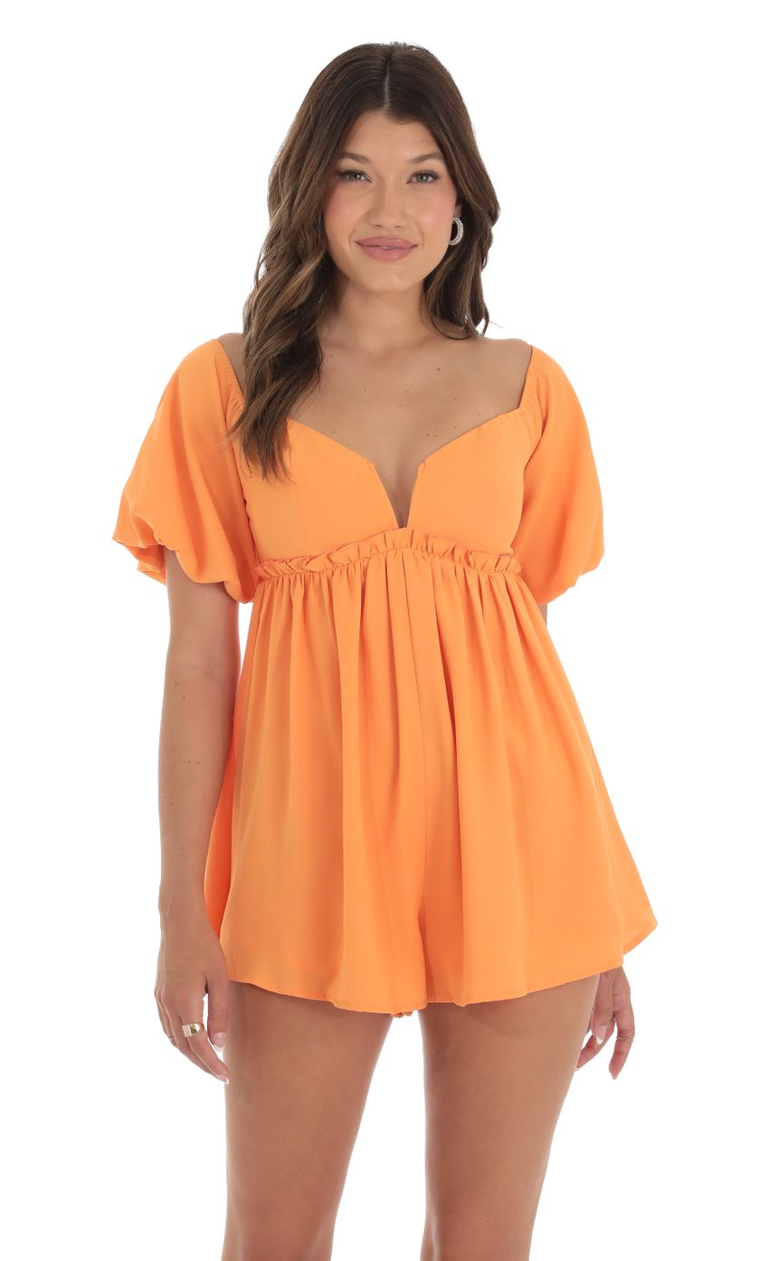 Picture Puff Sleeve Romper in Orange. Source: https://media-img.lucyinthesky.com/data/Sep23/850xAUTO/cd791d9c-08b9-4c18-97e7-5c4e8bdb52a3.jpg