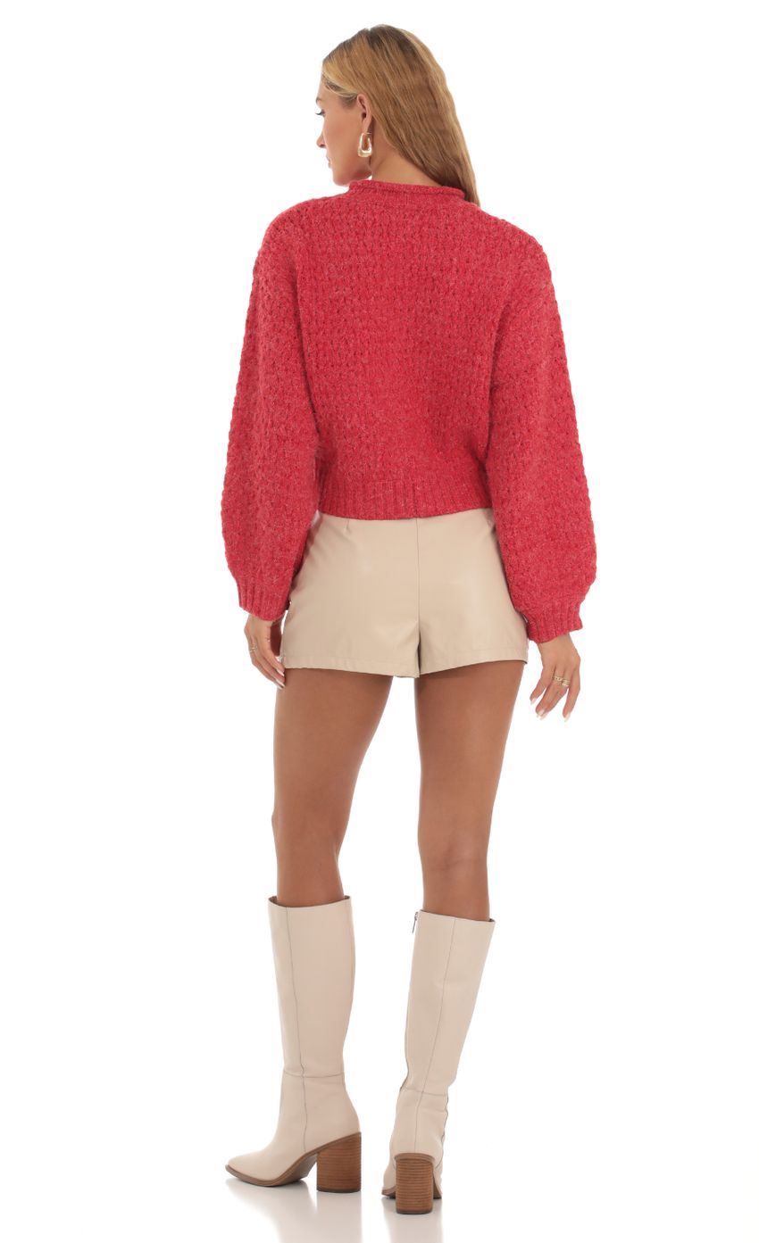 Picture Knit Mock Neck Jumper in Red. Source: https://media-img.lucyinthesky.com/data/Sep23/850xAUTO/d2803191-7a6c-4f77-94a4-4adc0322546c.jpg