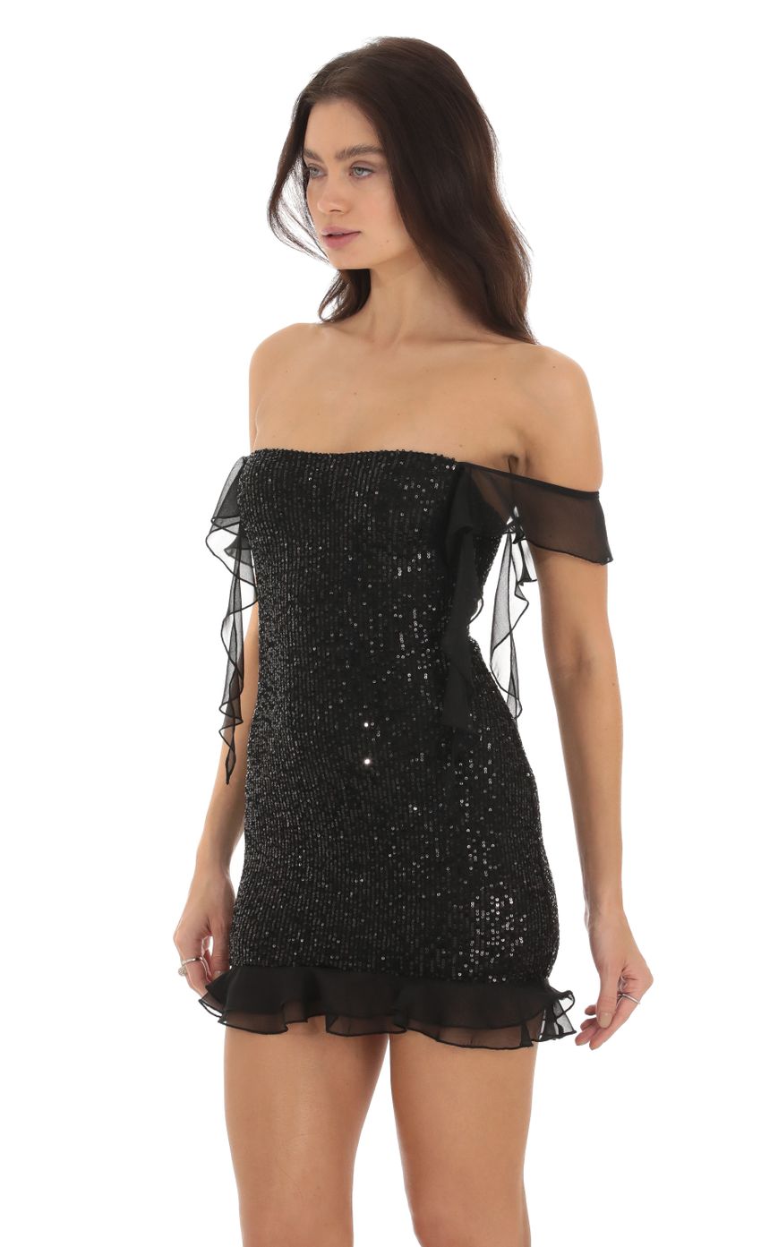 Picture Sequin Off Shoulder Dress in Black. Source: https://media-img.lucyinthesky.com/data/Sep23/850xAUTO/e5d02585-1b0c-4a5e-9e2f-afff7ba2c5c5.jpg