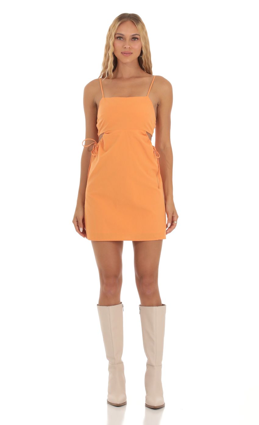 Picture Side Cutout Dress in Orange. Source: https://media-img.lucyinthesky.com/data/Sep23/850xAUTO/fcd524f5-958d-4e2b-befd-c2c3e97879f5.jpg