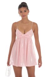 Picture Sequin Front Bow Babydoll Dress in Pink. Source: https://media-img.lucyinthesky.com/data/Sep24/150xAUTO/07e7e785-bc7c-4411-91b5-2ac995196cd6.jpg