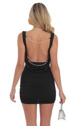 Picture Pearl Strap Open Back Dress in Black. Source: https://media-img.lucyinthesky.com/data/Sep24/150xAUTO/1160bac6-cfcf-4444-af40-b97df941ef87.jpg