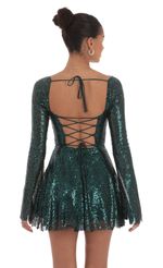 Picture Sequin Long Sleeve Fit and Flare Dress in Green. Source: https://media-img.lucyinthesky.com/data/Sep24/150xAUTO/36d95ad7-a7ed-43ee-8d98-97bcbc6f4b35.jpg