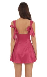 Picture Back Bows Dress in Magenta. Source: https://media-img.lucyinthesky.com/data/Sep24/150xAUTO/69cab332-870a-4b1d-abed-b2afb2a871cd.jpg