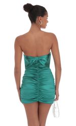 Picture Satin Ruched Back Bow Dress in Jungle Green. Source: https://media-img.lucyinthesky.com/data/Sep24/150xAUTO/cf3559e0-67c8-4c76-83b9-1a1f3db036ca.jpg