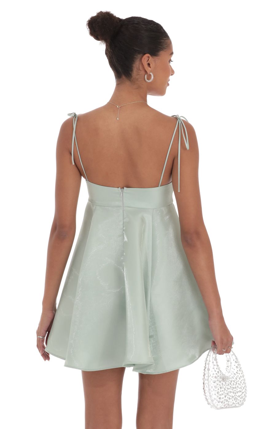 Picture Sheen Flare Babydoll Dress in Sage Green. Source: https://media-img.lucyinthesky.com/data/Sep24/850xAUTO/21be7e98-751a-4c23-8d29-52ca235210ce.jpg