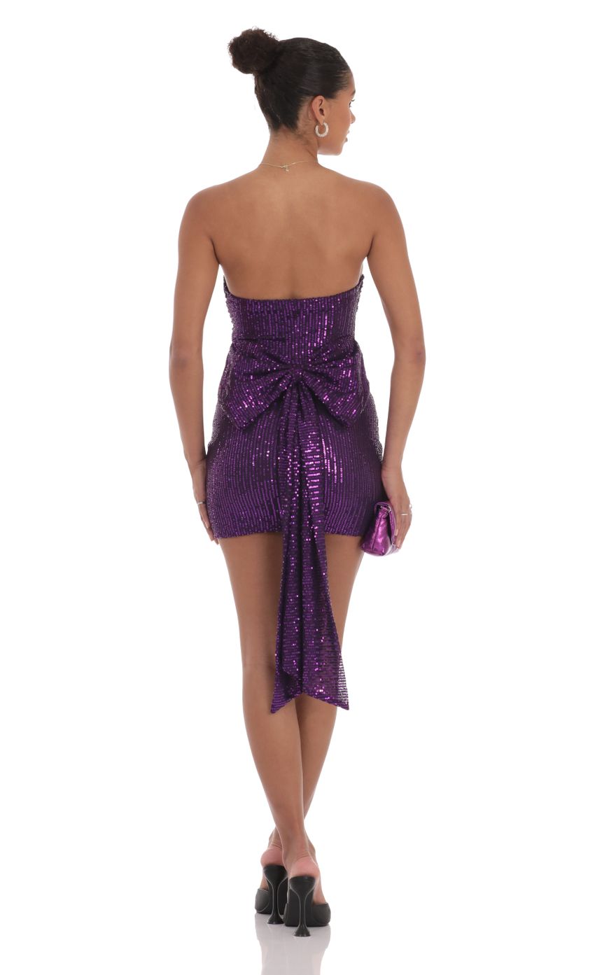 Picture Bow Draped Sequin Dress in Purple. Source: https://media-img.lucyinthesky.com/data/Sep24/850xAUTO/39668e68-05f0-435b-8a40-c8da501f1283.jpg