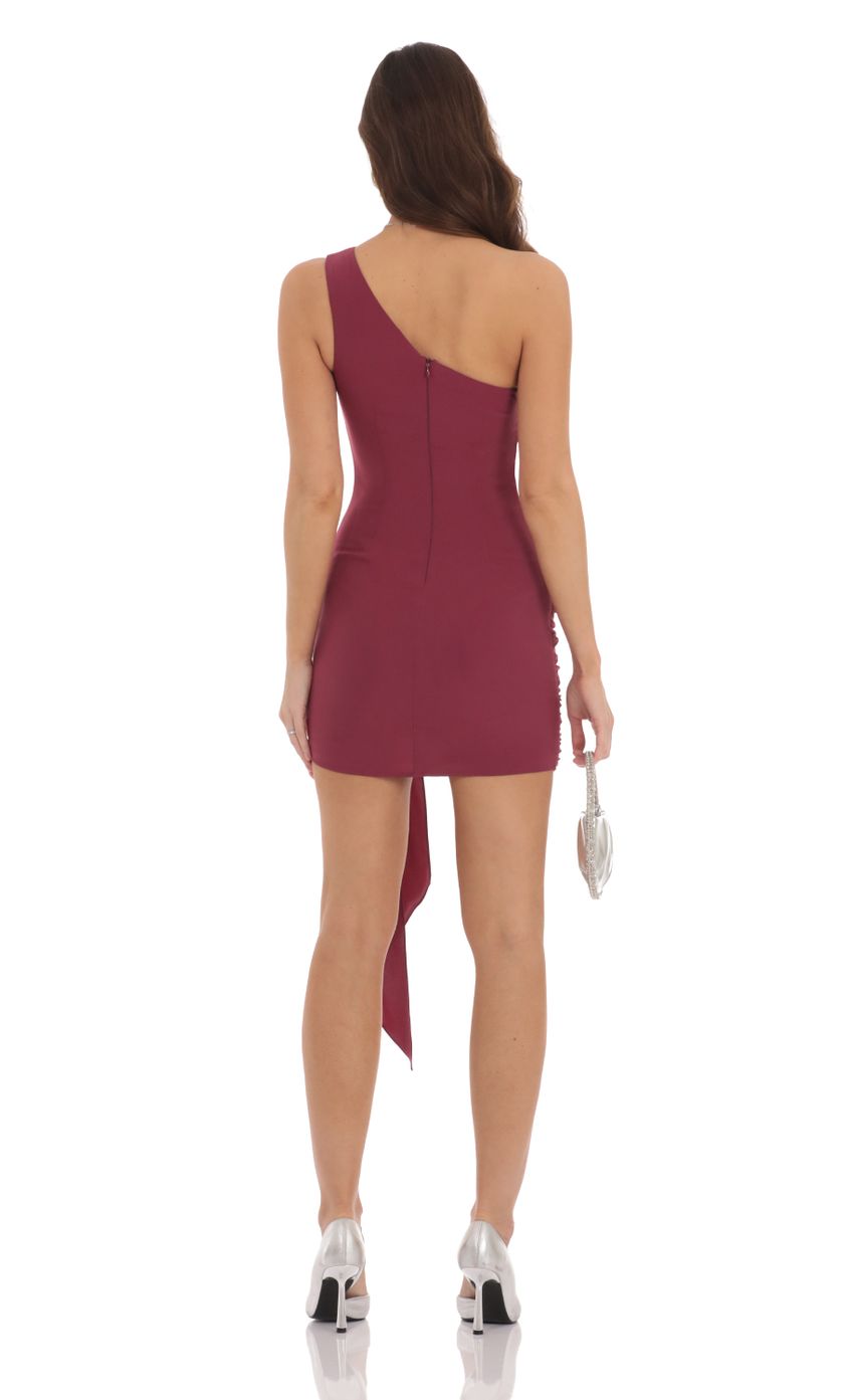 Picture One Shoulder Tassel Dress in Maroon Plum. Source: https://media-img.lucyinthesky.com/data/Sep24/850xAUTO/5687a312-c710-45fd-8301-a47955cce32d.jpg