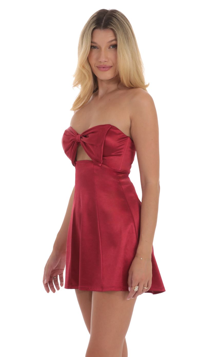 Picture Satin Bow Cutout Strapless Dress in Red. Source: https://media-img.lucyinthesky.com/data/Sep24/850xAUTO/5bd339cd-568d-4f83-8797-6a75f9a00176.jpg