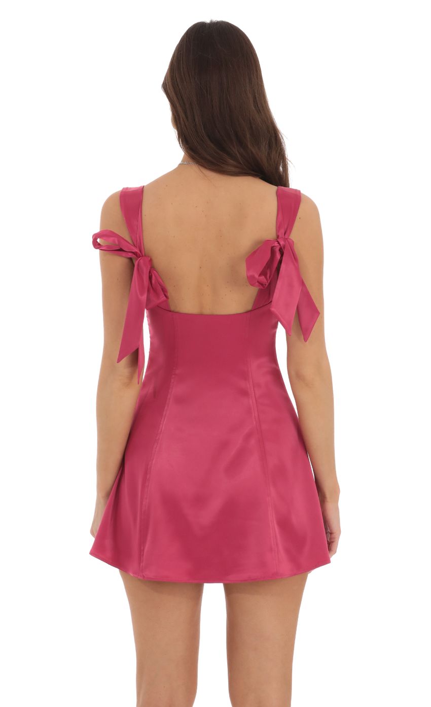 Picture Back Bows Dress in Magenta. Source: https://media-img.lucyinthesky.com/data/Sep24/850xAUTO/69cab332-870a-4b1d-abed-b2afb2a871cd.jpg