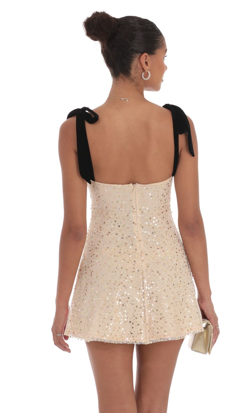 Picture Sequin Velvet Strap Dress in Beige. Source: https://media-img.lucyinthesky.com/data/Sep24/850xAUTO/727675f3-db3d-4861-9912-b165ccbeb92a.jpg